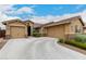 Beautiful home featuring a spacious driveway, three-car garage, and manicured bushes at 18368 W Long Lake Rd, Goodyear, AZ 85338