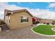 Charming exterior with stucco, desert landscaping, and a cozy backyard oasis at 18368 W Long Lake Rd, Goodyear, AZ 85338