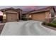 Beautiful home featuring a spacious driveway, three-car garage, and manicured bushes at 18368 W Long Lake Rd, Goodyear, AZ 85338