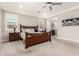 A spacious primary bedroom features a ceiling fan and carpeted floors and plantation shutters at 18368 W Long Lake Rd, Goodyear, AZ 85338