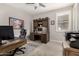 A home office with a built-in desk and storage cabinets, offering a functional workspace at 18368 W Long Lake Rd, Goodyear, AZ 85338