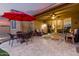 Relaxing outdoor patio with comfortable seating and elegant travertine tile at 18368 W Long Lake Rd, Goodyear, AZ 85338