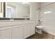 Bathroom features a double sink vanity and shower over bath combination at 19039 W Rose Ln, Waddell, AZ 85355
