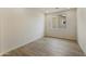 A bright bedroom with wood-style flooring and a window at 19039 W Rose Ln, Waddell, AZ 85355