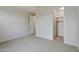 Neutral bedroom with a carpet floor, a ceiling light, and access to an attached closet at 19039 W Rose Ln, Waddell, AZ 85355