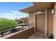 Apartment balcony with view; a welcoming entrance with secured railing adds charm to the building's facade at 20100 N 78Th Pl # 2203, Scottsdale, AZ 85255
