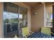 Outdoor balcony with seating area and sliding glass doors, offering a serene outdoor space at 20100 N 78Th Pl # 2203, Scottsdale, AZ 85255