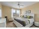 Primary bedroom boasts a ceiling fan and many windows at 20100 N 78Th Pl # 2203, Scottsdale, AZ 85255