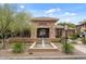 Elegant clubhouse entrance with stone accents, fountain and manicured landscaping, plus visible fire lane at 20100 N 78Th Pl # 2203, Scottsdale, AZ 85255