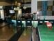 A community bar with stylish lighting, seating, and modern decor provides a social gathering space at 20100 N 78Th Pl # 2203, Scottsdale, AZ 85255