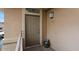 Apartment 2203 front entrance features a neutral-colored door, exterior light, and a welcome mat at 20100 N 78Th Pl # 2203, Scottsdale, AZ 85255