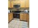 Modern kitchen with stainless steel appliances and tile floors at 20100 N 78Th Pl # 2203, Scottsdale, AZ 85255