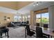 Open living space with neutral decor, dining area, and abundant natural light from large windows and sliding doors at 20100 N 78Th Pl # 2203, Scottsdale, AZ 85255