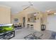 Open-concept living area with neutral walls, a dining table, breakfast bar, and views of the entry door at 20100 N 78Th Pl # 2203, Scottsdale, AZ 85255