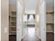 Hallway view to bath area features a large tub and decorative glass blocks at 21525 E Camacho Rd, Queen Creek, AZ 85142