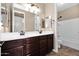 Bathroom with a double sink vanity, shower and tub combo, and tile flooring at 21525 E Camacho Rd, Queen Creek, AZ 85142