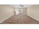 Large bedroom with neutral paint and carpet plus window allowing natural light at 21525 E Camacho Rd, Queen Creek, AZ 85142