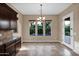 Bright dining area with backyard views, next to the kitchen, and direct access to the patio at 21525 E Camacho Rd, Queen Creek, AZ 85142