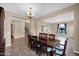 Dining room with dining table, staircase and open floor plan at 21525 E Camacho Rd, Queen Creek, AZ 85142