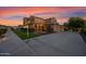 Stately home with For Sale sign, beautiful landscaping, and a circular driveway at 21525 E Camacho Rd, Queen Creek, AZ 85142