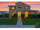 Attractive home with a well-kept lawn and welcoming front entrance at 21525 E Camacho Rd, Queen Creek, AZ 85142