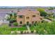Beautiful two-story home featuring manicured landscaping, desert plants, and an inviting entryway at 21525 E Camacho Rd, Queen Creek, AZ 85142