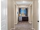 Hallway with beverage center featuring mini fridge, sink, and window with great light at 21525 E Camacho Rd, Queen Creek, AZ 85142