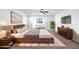 Spacious primary bedroom featuring a platform bed, modern decor, and ample natural light from windows at 21525 E Camacho Rd, Queen Creek, AZ 85142