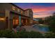 Outdoor patio with dining and lounge furniture, showcasing backyard pool at 21525 E Camacho Rd, Queen Creek, AZ 85142