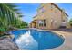 Backyard with pool and spa is surrounded by lush landscaping, creating a private oasis at 21525 E Camacho Rd, Queen Creek, AZ 85142