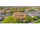 Backyard oasis with lush landscaping, pool, and covered patio, perfect for entertaining at 21525 E Camacho Rd, Queen Creek, AZ 85142