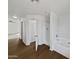 Bright bathroom with a soaking tub, stand up shower, and wood look flooring at 217 E Gwen St, Phoenix, AZ 85042