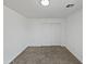 Neutral carpeted bedroom features double doors and bright recessed lighting at 217 E Gwen St, Phoenix, AZ 85042
