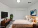 Cozy bedroom featuring neutral colors, soft lighting, and modern decor at 217 E Gwen St, Phoenix, AZ 85042