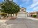 Charming two-story home with a well-manicured lawn, large tree and a spacious two car garage at 217 E Gwen St, Phoenix, AZ 85042