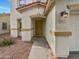 Close-up shot of the home's front entrance, complete with address, decorative stonework, and security door at 217 E Gwen St, Phoenix, AZ 85042