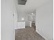 Upstairs landing featuring neutral carpet and white walls, creating a bright and open space at 217 E Gwen St, Phoenix, AZ 85042
