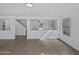 Inviting living room with a half wall to view other rooms, tile flooring, and lots of natural light at 217 E Gwen St, Phoenix, AZ 85042