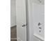 Close-up of a clean white shower showcasing modern fixtures and a door leading to the hallway at 217 E Gwen St, Phoenix, AZ 85042