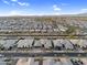 Sweeping aerial view of a suburban neighborhood featuring neatly arranged homes and manicured green spaces at 22884 E Via De Olivos --, Queen Creek, AZ 85142