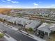 High-angle view of homes with desert landscaping, tile roofs, and a glimpse of the surrounding neighborhood at 22884 E Via De Olivos --, Queen Creek, AZ 85142