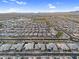 High-definition aerial view showcasing a neighborhood with a golf course and uniform housing arrangements at 22884 E Via De Olivos --, Queen Creek, AZ 85142