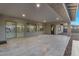 Spacious open patio with travertine flooring, featuring outdoor lighting and views of backyard; perfect for entertaining at 22884 E Via De Olivos --, Queen Creek, AZ 85142