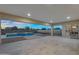 Spacious covered patio with views of the pool, putting green, and landscape provides a tranquil outdoor living space at 22884 E Via De Olivos --, Queen Creek, AZ 85142