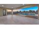 Expansive back patio featuring travertine flooring, views of the pool, and a meticulously landscaped backyard, perfect for outdoor entertainment at 22884 E Via De Olivos --, Queen Creek, AZ 85142