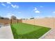 Backyard showcasing a putting green with artificial turf and desert landscaping at 22884 E Via De Olivos --, Queen Creek, AZ 85142
