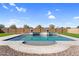 Private pool area enhanced with custom stonework, flourishing greenery, and durable brick fencing for ultimate relaxation at 22884 E Via De Olivos --, Queen Creek, AZ 85142