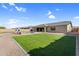 Spacious backyard featuring a lush lawn, gravel landscaping, and a covered patio area perfect for outdoor entertaining at 22884 E Via De Olivos --, Queen Creek, AZ 85142