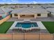 Beautiful backyard featuring a pristine pool, a well-maintained lawn, and a covered patio, perfect for outdoor enjoyment at 22884 E Via De Olivos --, Queen Creek, AZ 85142