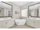 Luxurious bathroom with dual sinks and a soaking tub at 22884 E Via De Olivos --, Queen Creek, AZ 85142